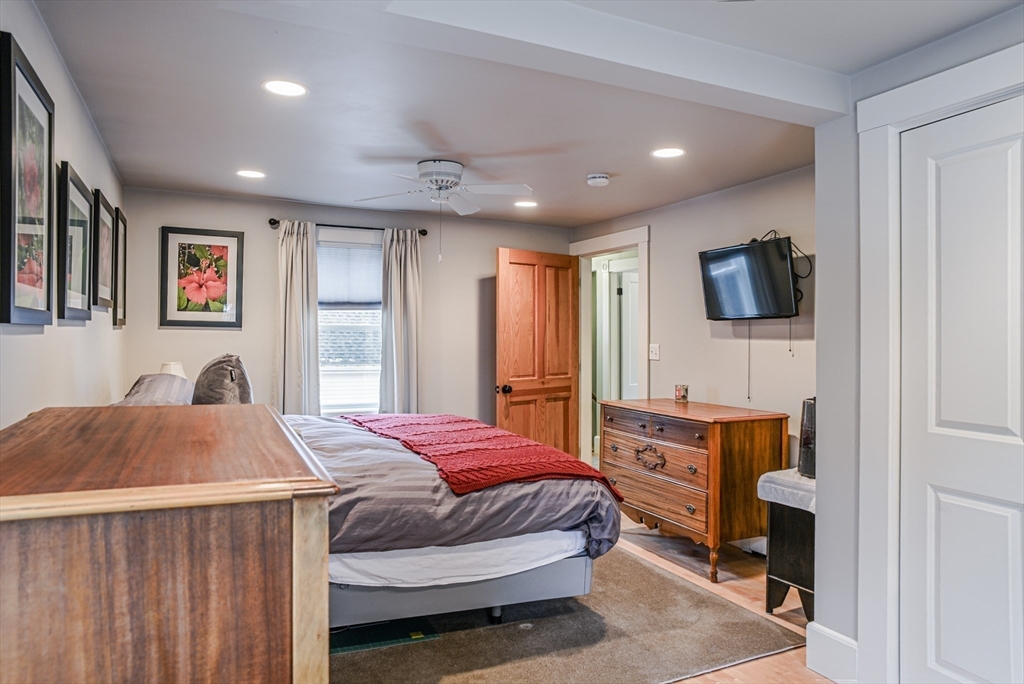 42 Bisson Street Beverly, MA 01915 - Photo 16 of 28 a bedroom with a bed and a flat screen tv