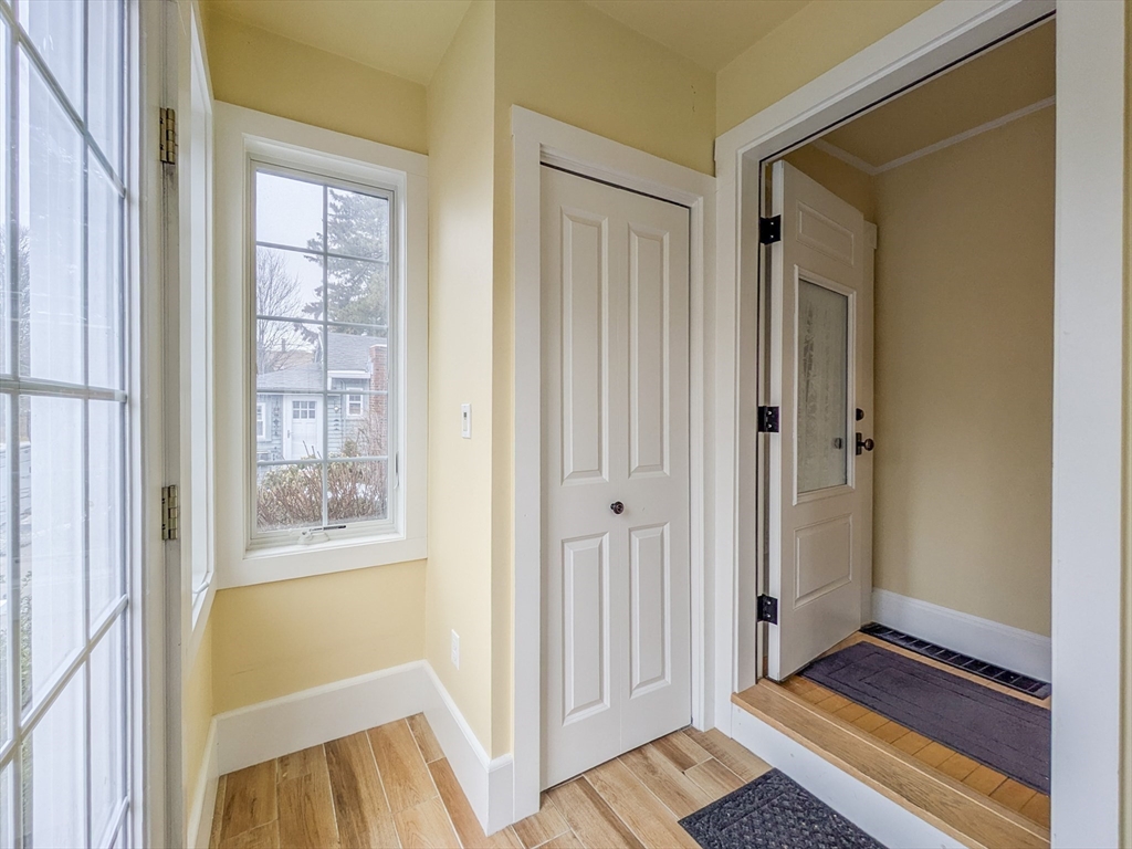 42 Bisson Street Beverly, MA 01915 - Photo 3 of 28 a view of a bathroom with wooden floor and a sink