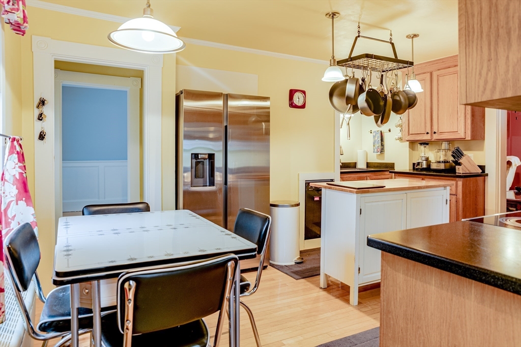 42 Bisson Street Beverly, MA 01915 - Photo 5 of 28 a kitchen with a table and chairs in it