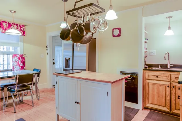 a kitchen with a table and chairs in it