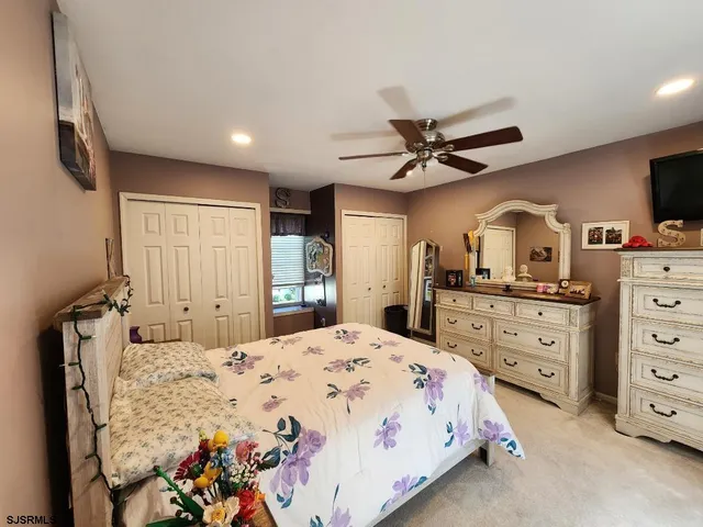 a bed room with a bed and a television