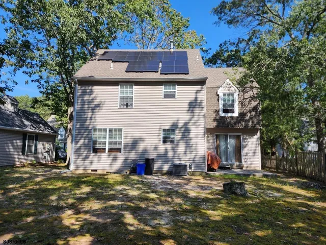 a front view of house with a yard