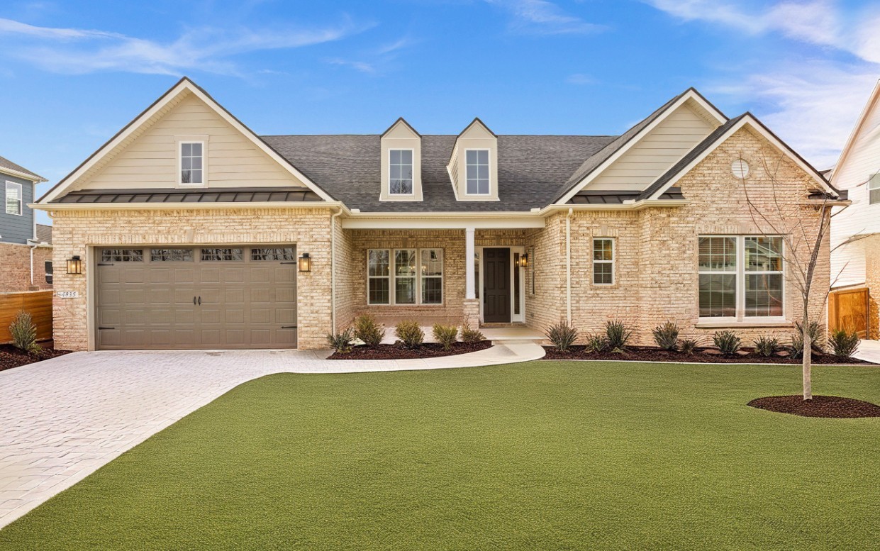 a front view of a house with swimming pool and yard