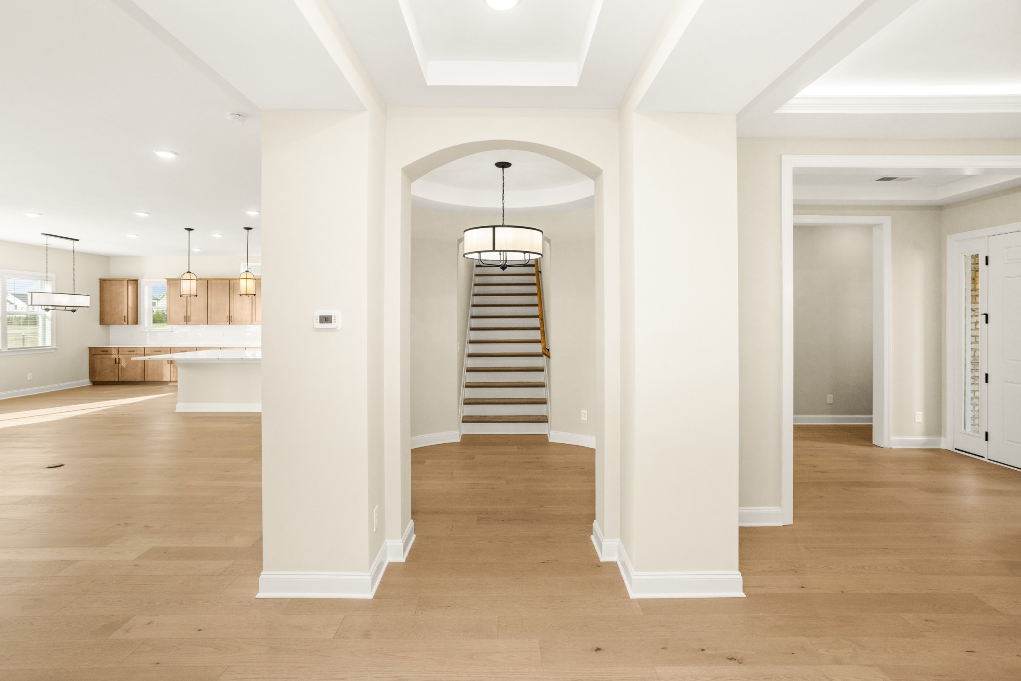 1935 Harmony Road Spring Hill, TN 37174 - Photo 29 of 60 a view of a hallway with wooden floor and a living room