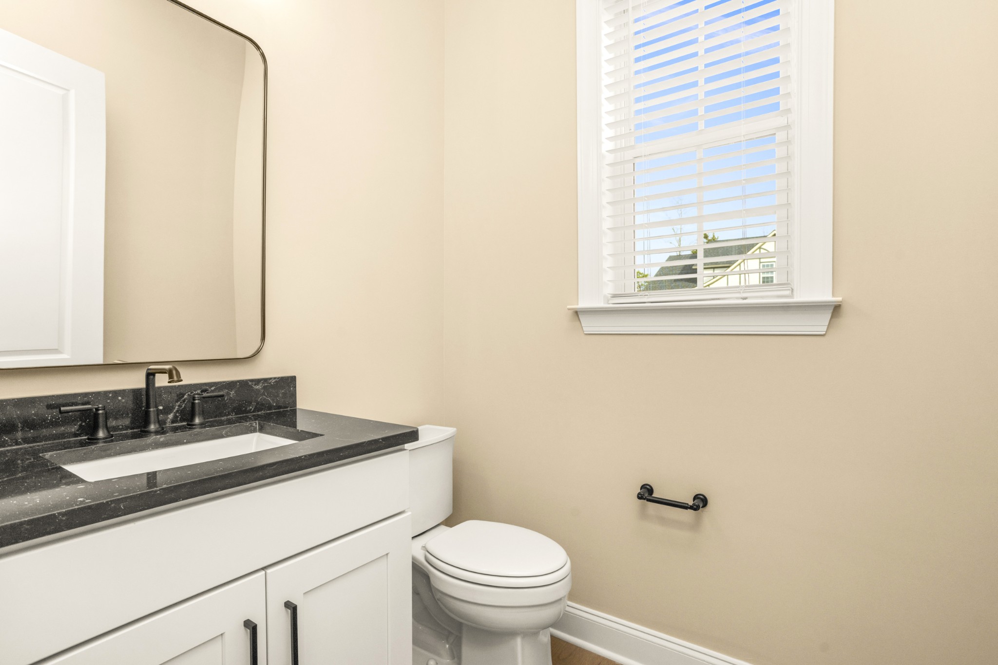 1935 Harmony Road Spring Hill, TN 37174 - Photo 38 of 60 a bathroom with a granite countertop sink toilet and mirror