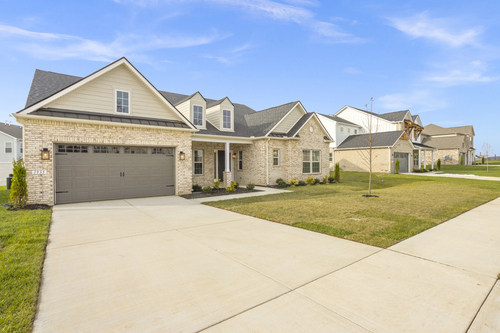1935 Harmony Road Spring Hill, TN 37174 - Photo 10 of 60 a front view of a house with a yard