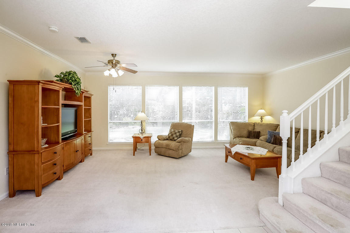 816 Mill Stream Road Ponte Vedra Beach, FL 32082 - Photo 3 of 20 a living room with furniture and a flat screen tv