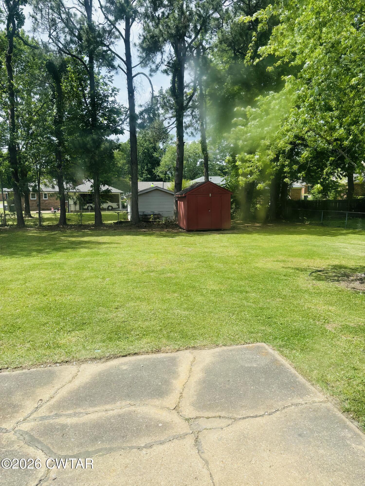 149 Commanche Trail Jackson, TN 38305 - Photo 13 of 15 a backyard of a house with lots of green space