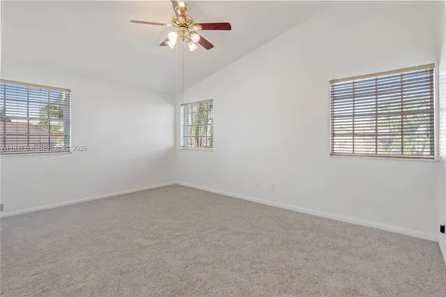 a view of empty room with windows