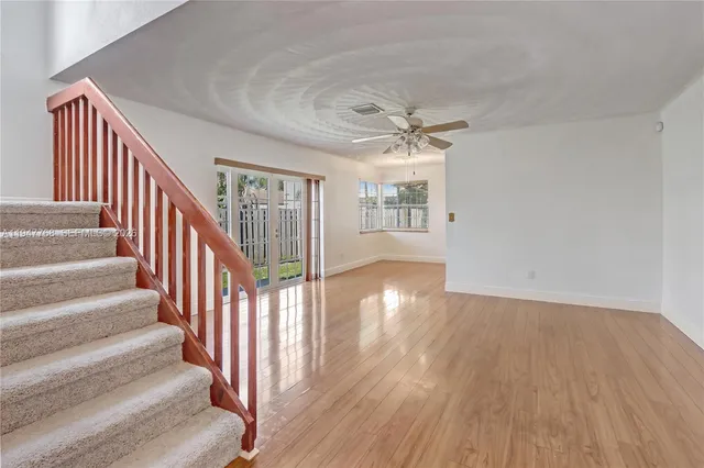 a view of an entryway with wooden floor