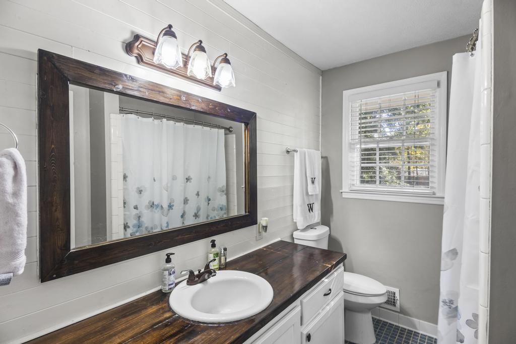 1934 Huntsman Drive Aiken, SC 29803 - Photo 12 of 19 a bathroom with a granite countertop sink mirror vanity and toilet