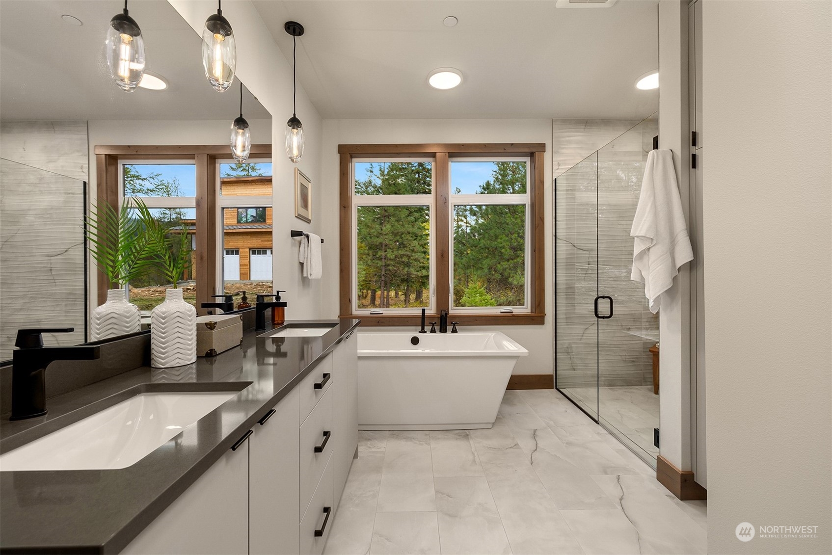 331 Old Grv Trail Ronald, WA 98940 - Photo 25 of 40 a large white bathroom with a granite countertop sink a large mirror and a bathtub next to a window