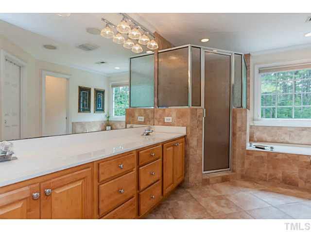 4724 Sharpstone Lane Raleigh, NC 27615 - Photo 14 of 25 a bathroom with a granite countertop sink mirror and double