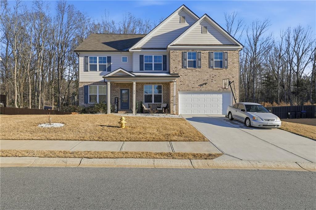 175 Paxton Lane Jefferson, GA 30549 - Photo 1 of 39 a front view of a house with a yard