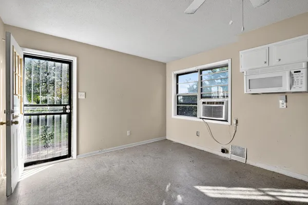 a kitchen with stainless steel appliances a refrigerator sink and cabinets