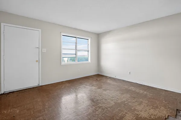 a kitchen with white cabinets and a sink