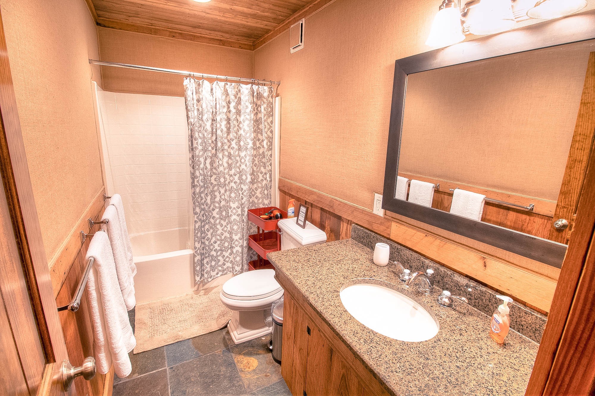 7394 Forest Glenn Road Fairview, TN 37062 - Photo 23 of 30 a bathroom with a granite countertop sink toilet and shower
