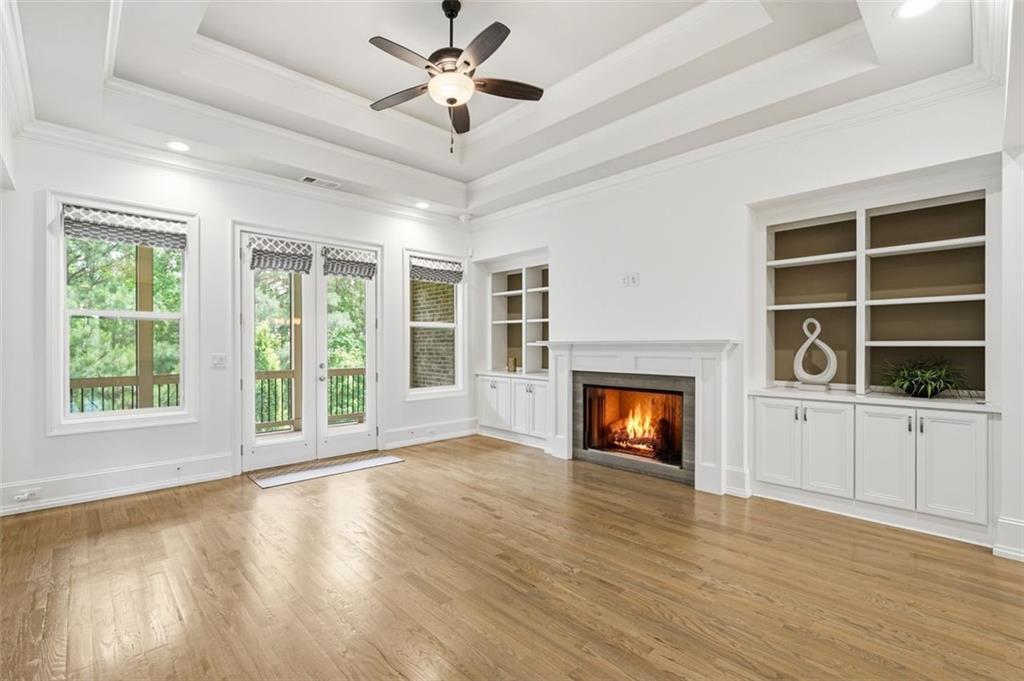 337 Rosshandler Road Suwanee, GA 30024 - Photo 14 of 45 a view of an empty room with a window and fireplace