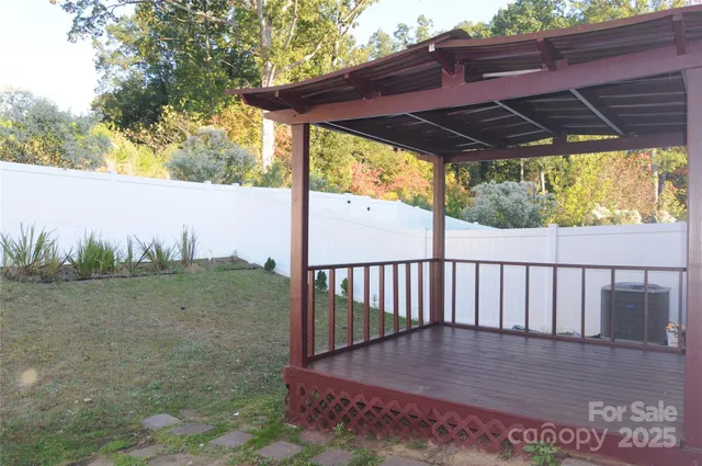 a view of a deck with wooden floor and outdoor space