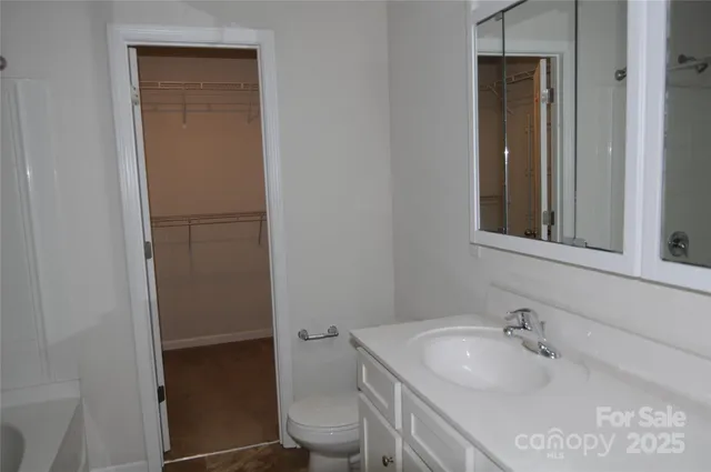 a bathroom with a sink and toilet