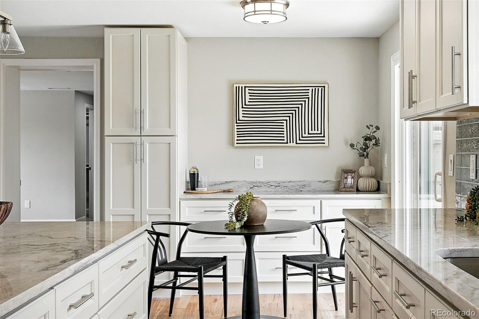 10320 West 35th Avenue Wheat Ridge, CO 80033 - Photo 11 of 46 a view of a dining room with furniture and chandelier