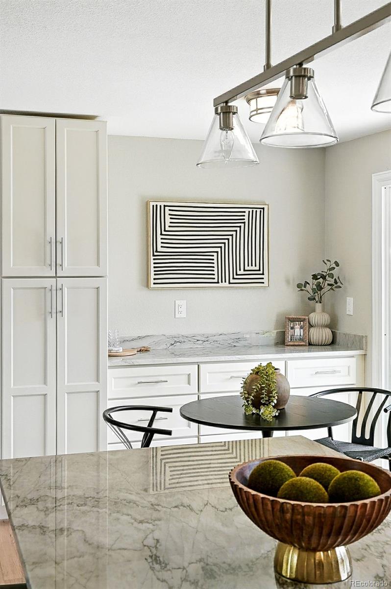 10320 West 35th Avenue Wheat Ridge, CO 80033 - Photo 12 of 46 a living room with furniture and a table