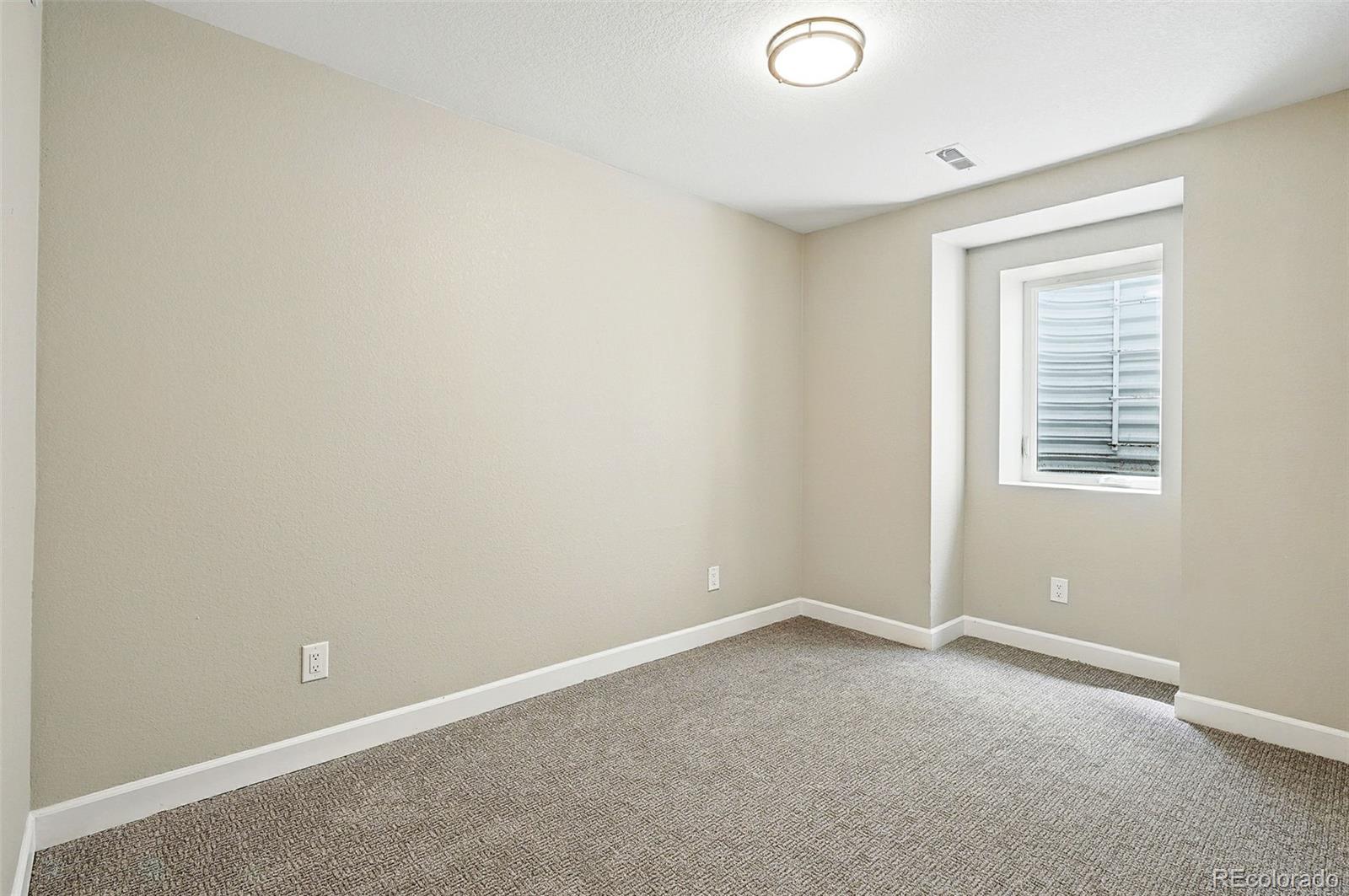 10320 West 35th Avenue Wheat Ridge, CO 80033 - Photo 32 of 46 an empty room with a window