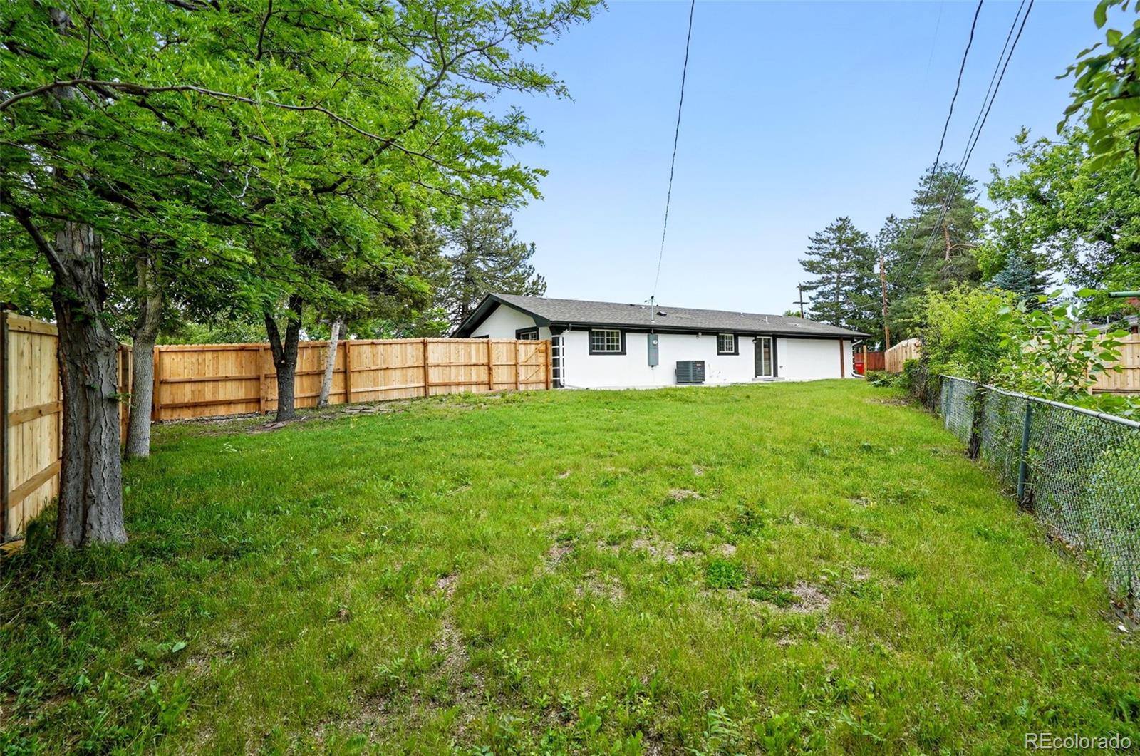 10320 West 35th Avenue Wheat Ridge, CO 80033 - Photo 39 of 46 a view of a house with a big yard