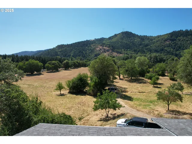 a view of a car park in front of house