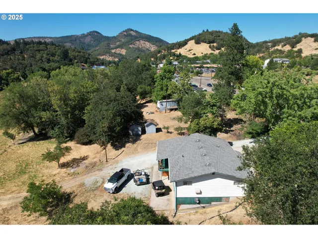 an aerial view of house with yard