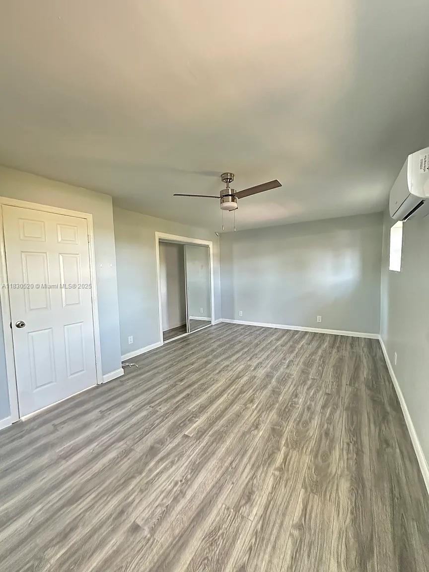 4410 26th Avenue, Unit 2 Vero Beach, FL 32967 - Photo 3 of 7 wooden floor in an empty room