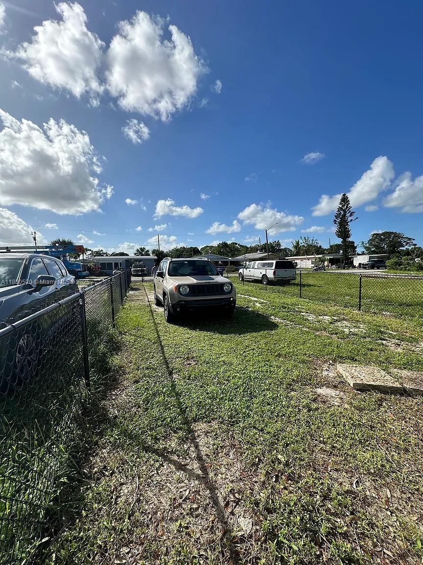 4410 26th Avenue, Unit 2 Vero Beach, FL 32967 - Photo 7 of 7 a view of a lake with a big yard