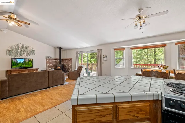 a kitchen with a refrigerator and a microwave