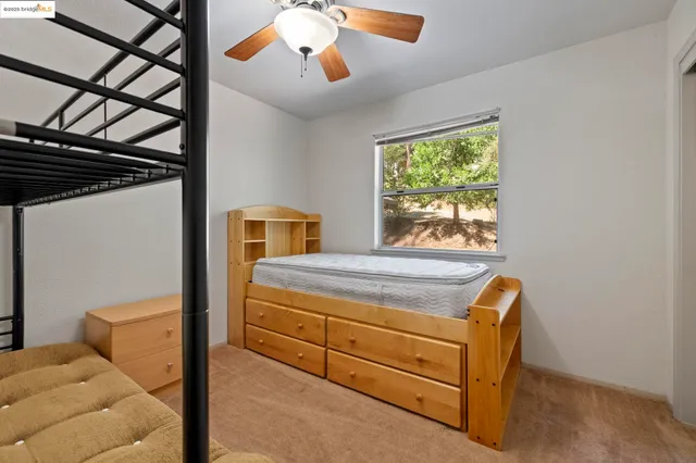 a bathroom with a sink vanity and mirror