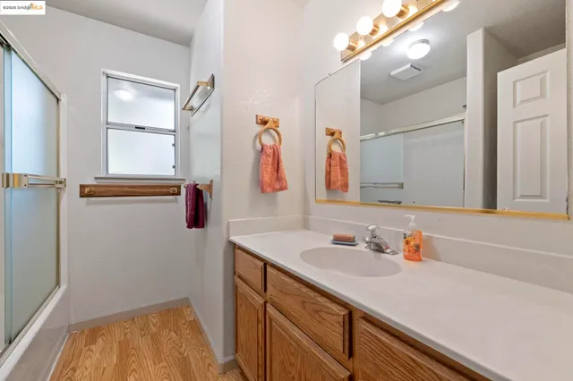 a bathroom with a tub a sink and a shower