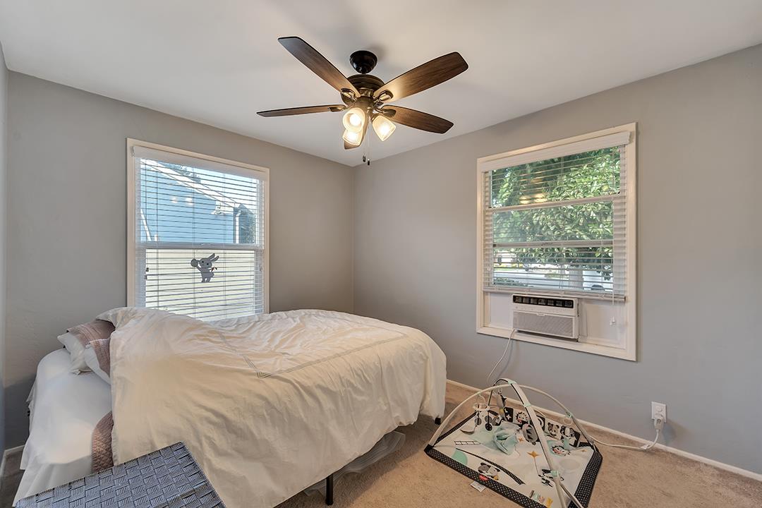 1197 Broadleaf Lane San Jose, CA 95128 - Photo 11 of 29 a bedroom with a bed and window