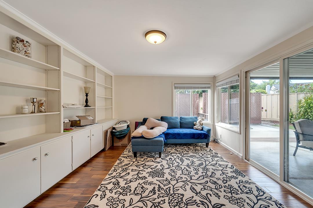 1197 Broadleaf Lane San Jose, CA 95128 - Photo 20 of 29 a living room with furniture and a rug