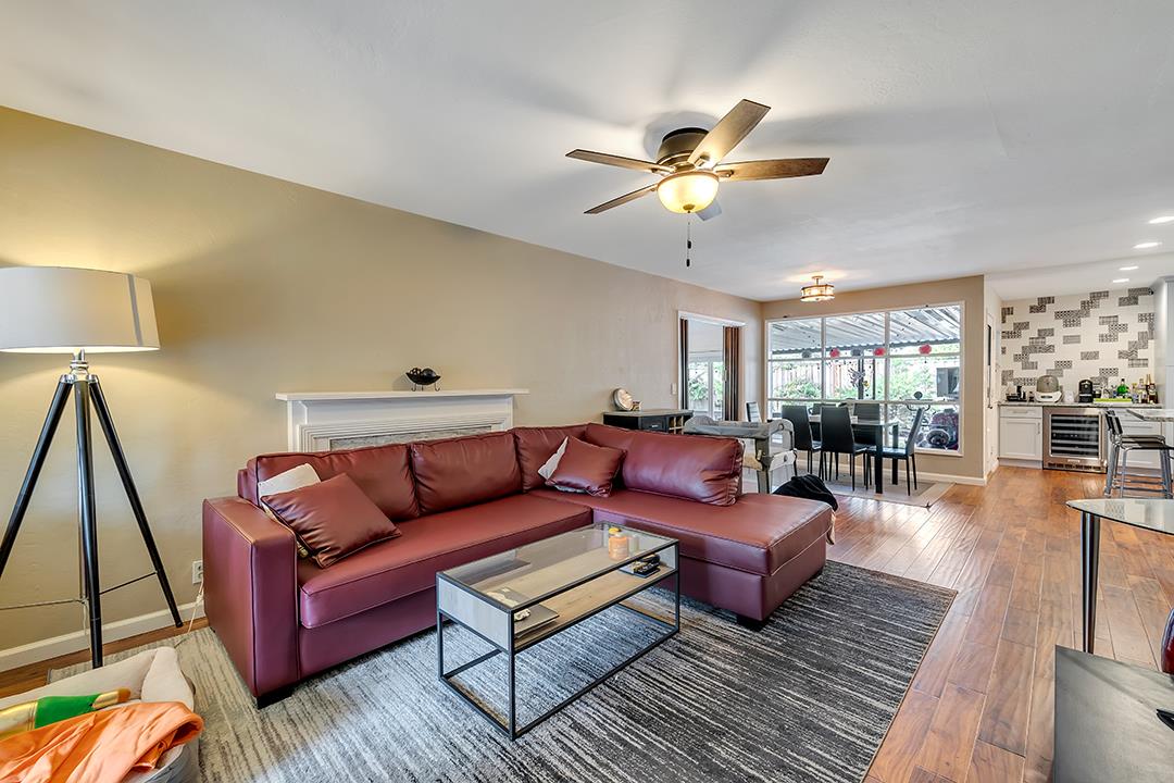 1197 Broadleaf Lane San Jose, CA 95128 - Photo 2 of 29 a living room with furniture and a wooden floor