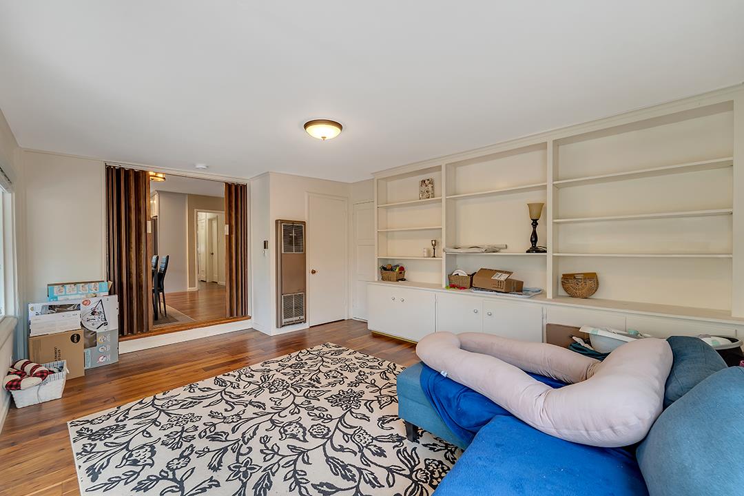1197 Broadleaf Lane San Jose, CA 95128 - Photo 21 of 29 a living room with furniture and a rug