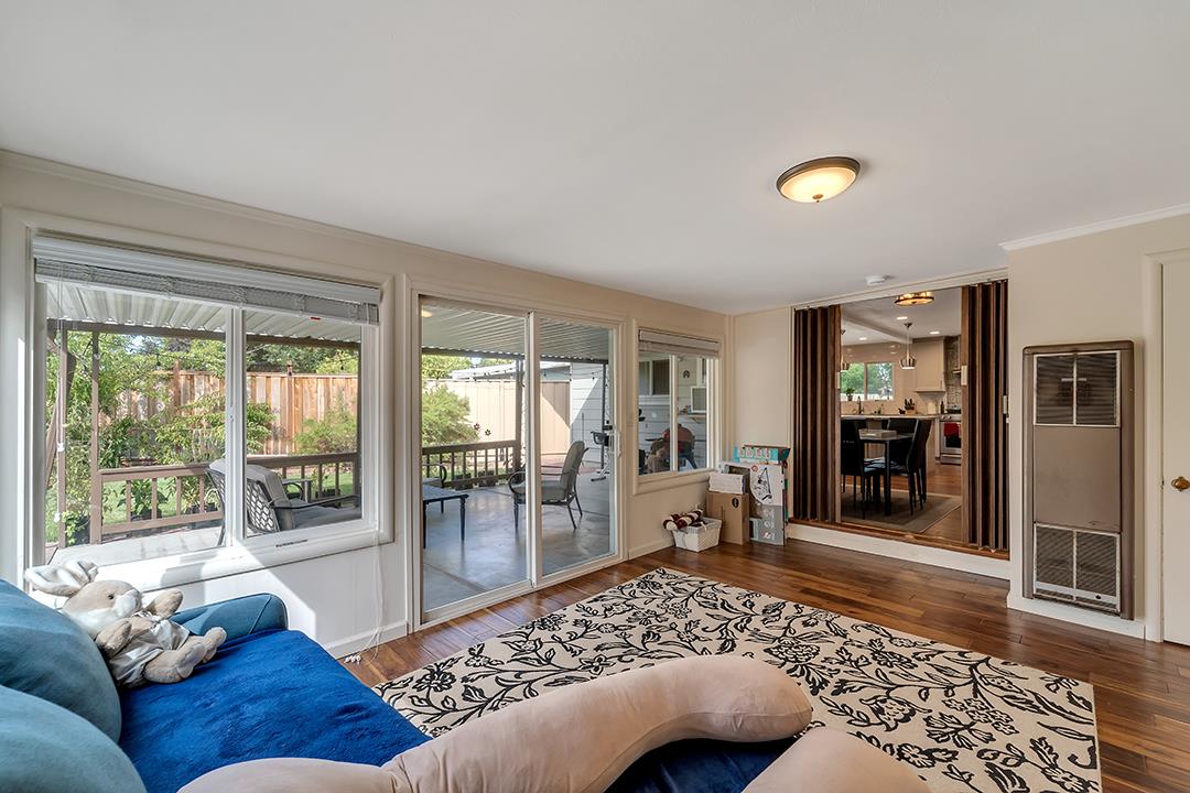 1197 Broadleaf Lane San Jose, CA 95128 - Photo 22 of 29 a living room with a couch and a large window