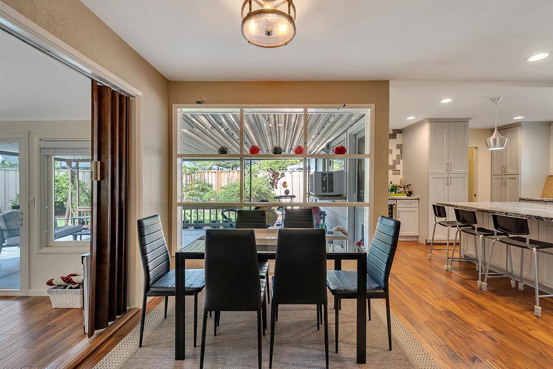 1197 Broadleaf Lane San Jose, CA 95128 - Photo 4 of 29 a view of a dining room with furniture window and wooden floor