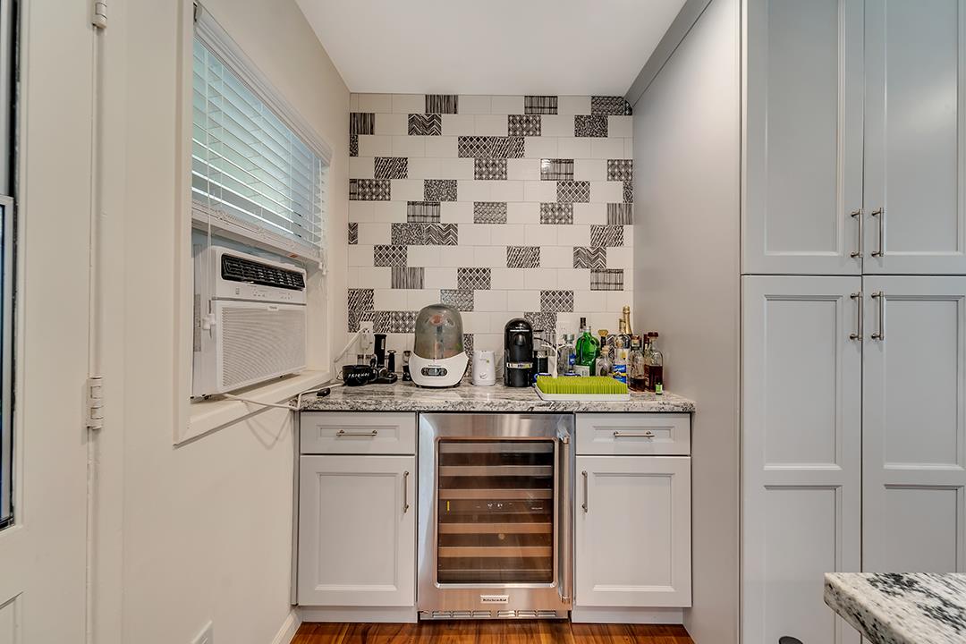 1197 Broadleaf Lane San Jose, CA 95128 - Photo 9 of 29 a kitchen with granite countertop white cabinets and appliances