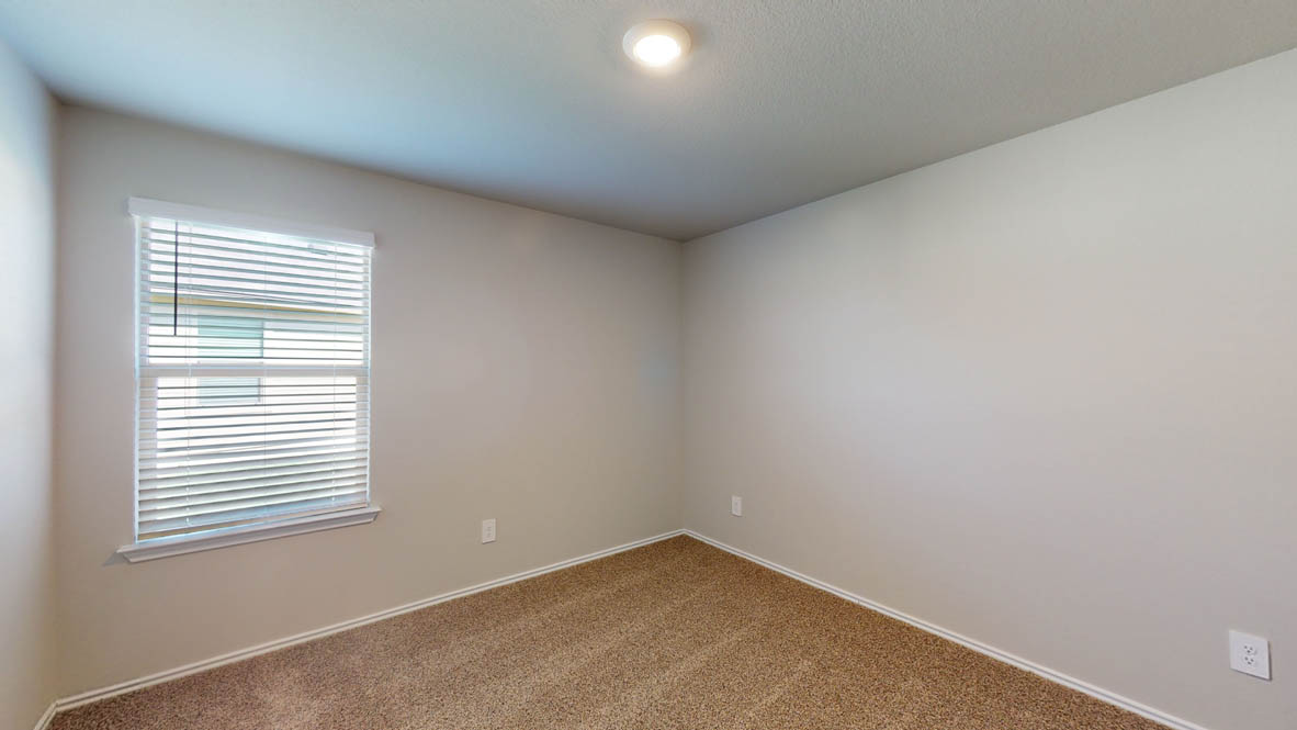 509 Hector Loop Georgetown, TX 78626 - Photo 23 of 31 Comfortable carpeted bedroom with window blinds and recessed lighting offers a quiet retreat.
