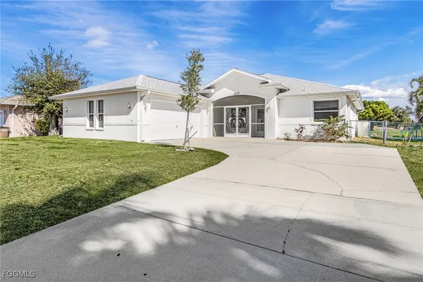 a front view of a house with a yard