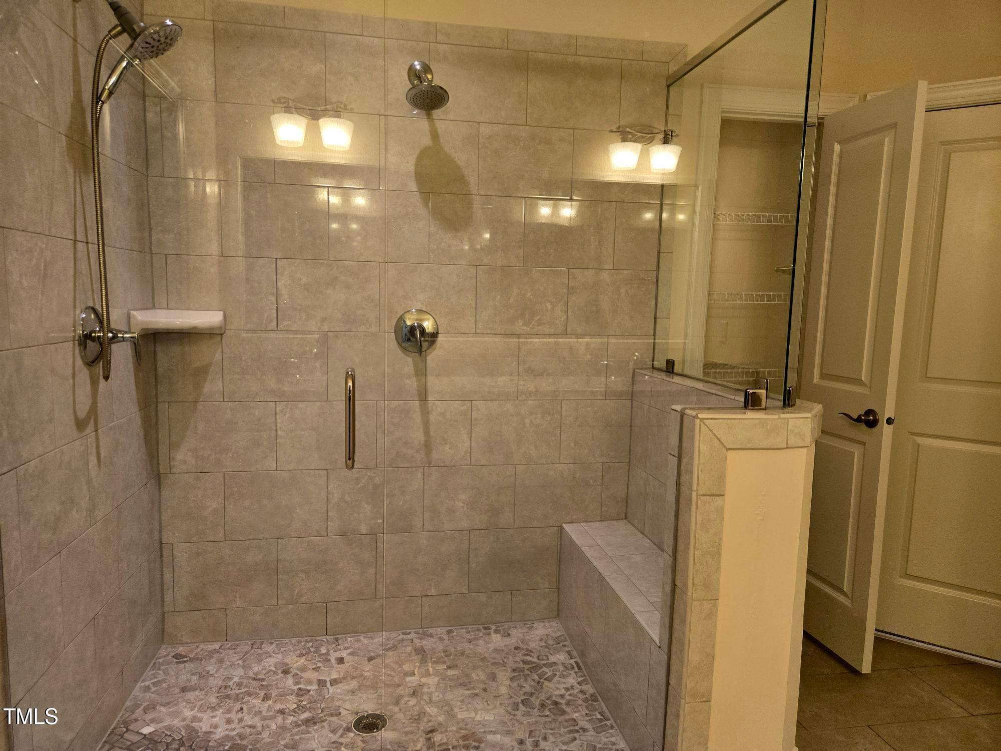 10420 Sablewood Drive, Unit 102 Raleigh, NC 27617 - Photo 12 of 15 a bathroom with a shower