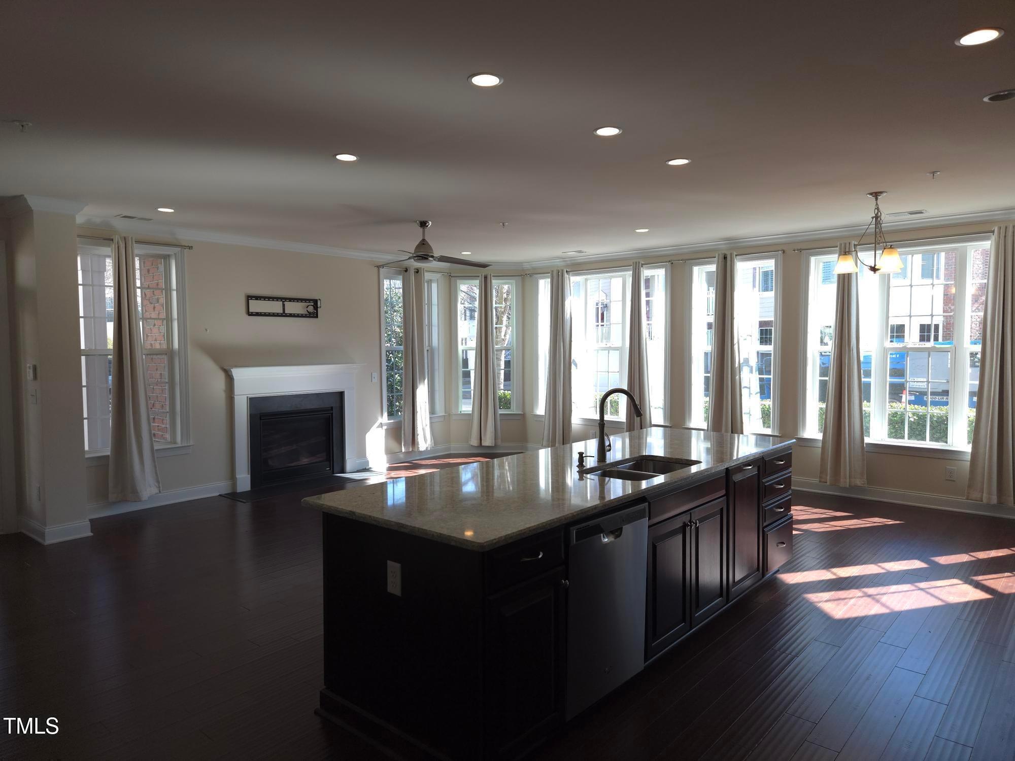 10420 Sablewood Drive, Unit 102 Raleigh, NC 27617 - Photo 3 of 15 a kitchen with granite countertop lots of counter top space
