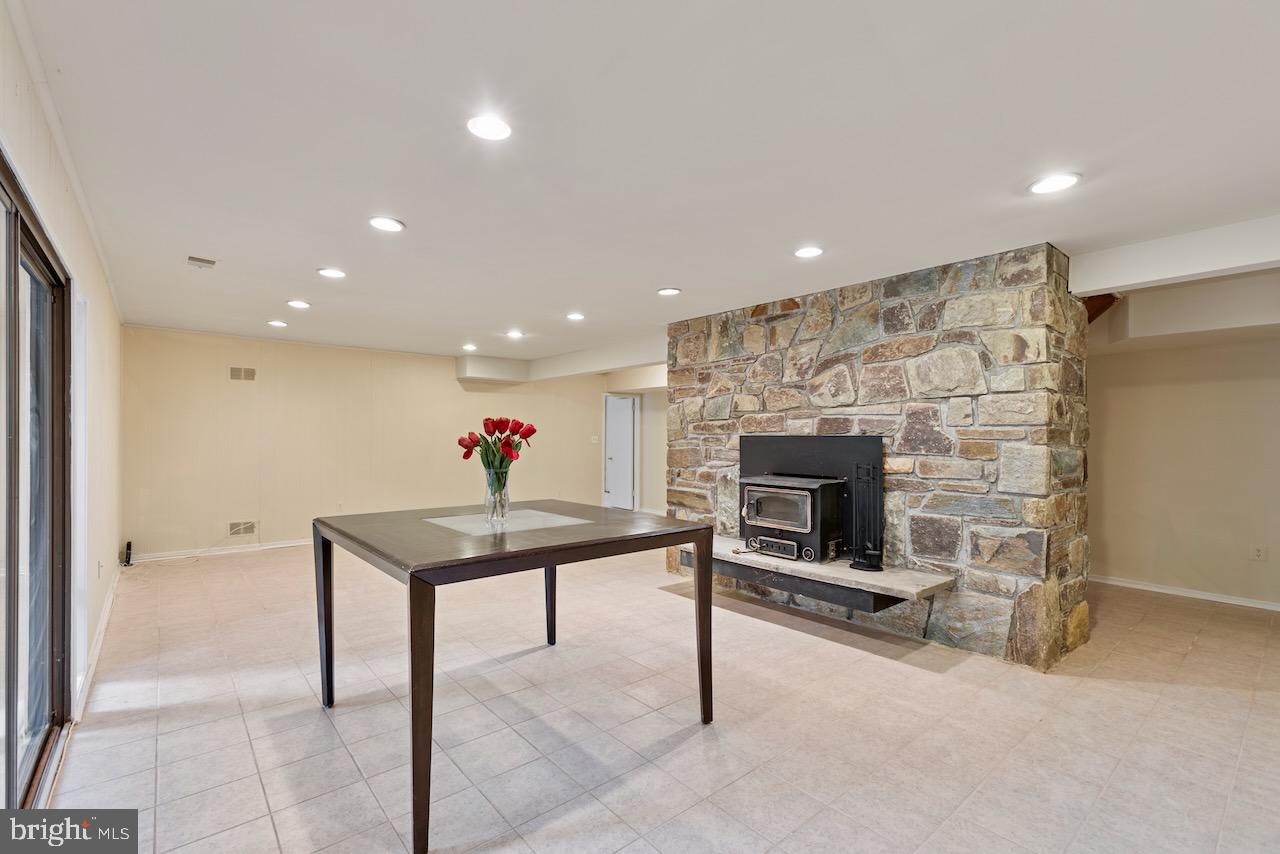 1404 Wolftrap Run Road Vienna, VA 22182 - Photo 23 of 33 Basement rec room w/ wood stove