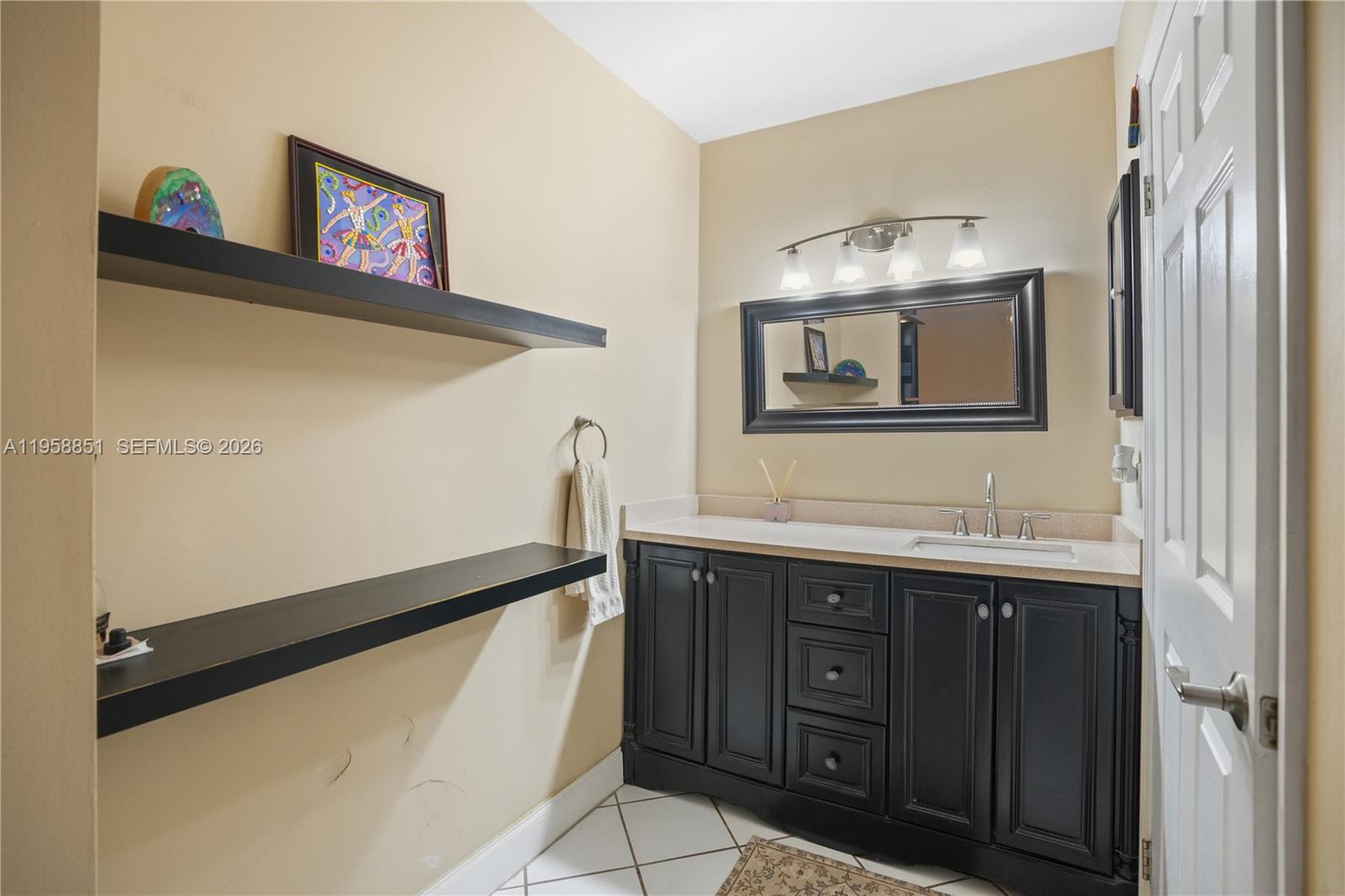 12930 Southwest 88th Terrace, Unit A104 Miami, FL 33186 - Photo 20 of 38 a kitchen with a sink and a refrigerator
