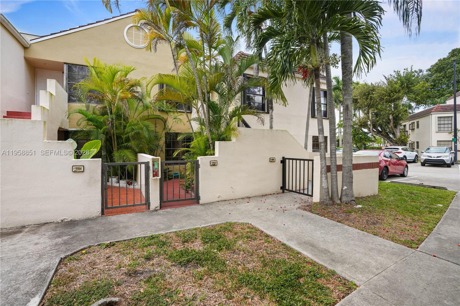 12930 Southwest 88th Terrace, Unit A104 Miami, FL 33186 - Photo 2 of 38 a view of a backyard of a house