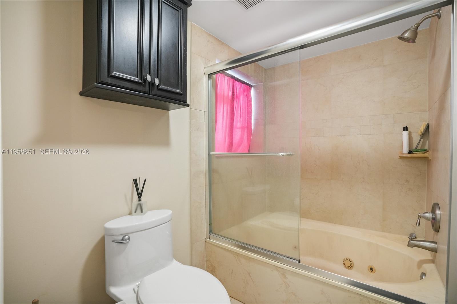 12930 Southwest 88th Terrace, Unit A104 Miami, FL 33186 - Photo 21 of 38 a bathroom with a granite countertop bathtub shower sink vanity and toilet
